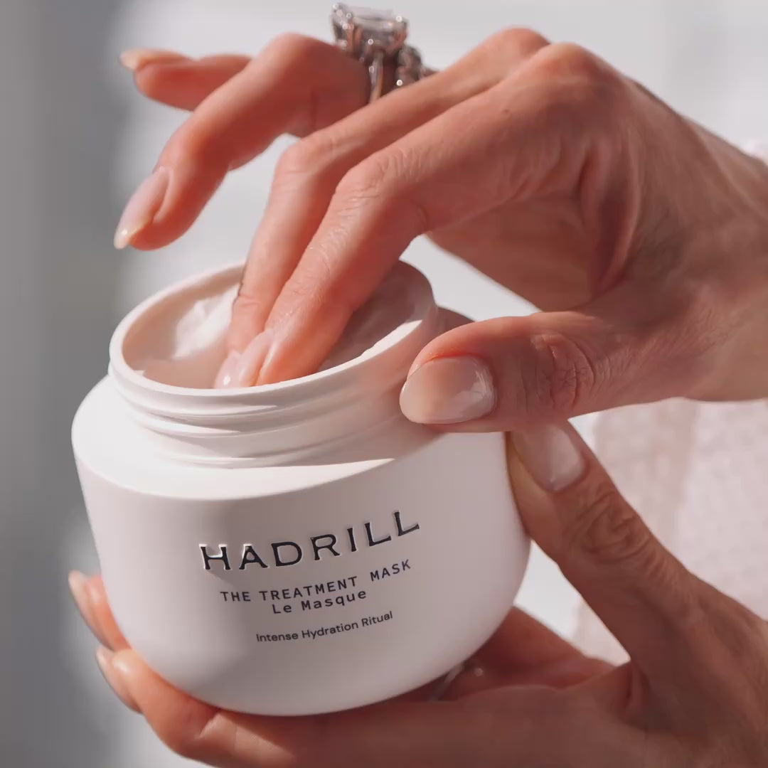 Hadrill Treatment Mask’s creamy texture being lifted from the jar